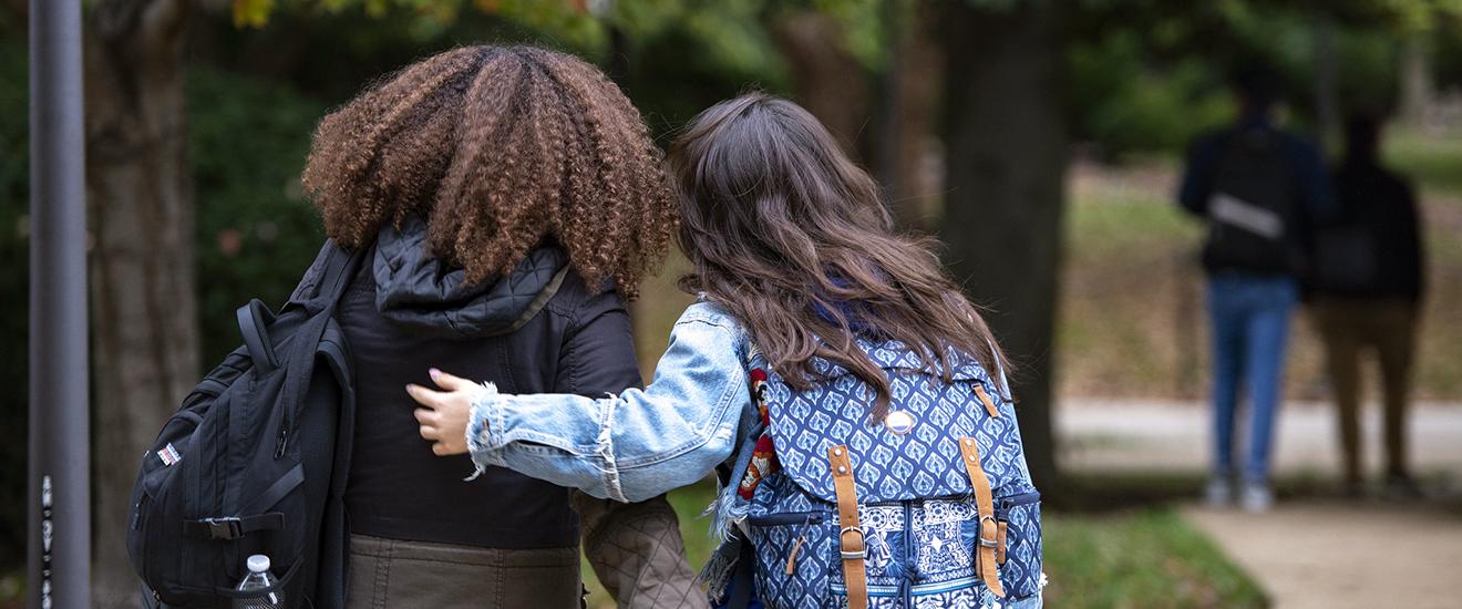 two students walking on campus