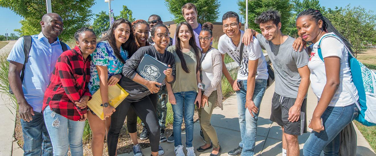 students gathered together smiling